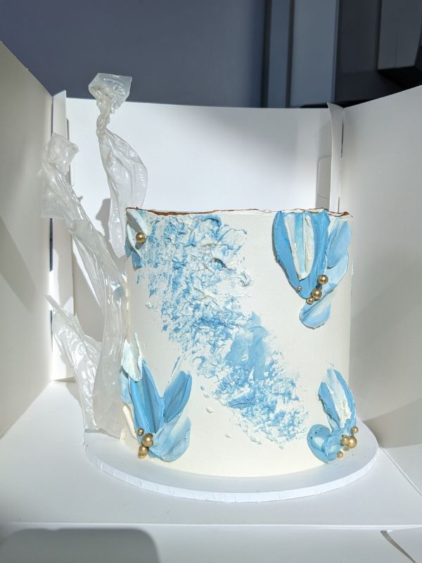 Blue white birthday caake