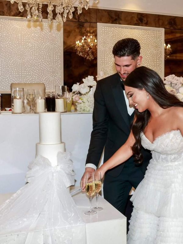 Couple celebrating with luxury wedding cake Melbourne
